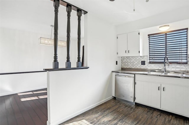 kitchen featuring decorative backsplash, stainless steel dishwasher, dark wood-style floors, white cabinetry, and a sink