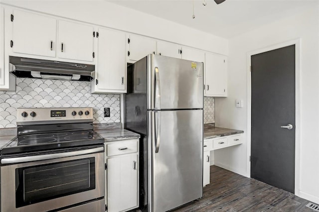 kitchen featuring under cabinet range hood, dark wood finished floors, white cabinetry, stainless steel appliances, and decorative backsplash