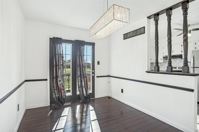 entrance foyer with a healthy amount of sunlight, baseboards, and hardwood / wood-style flooring