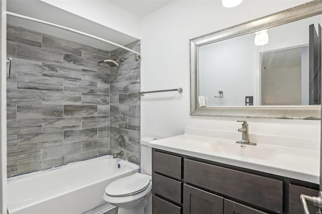 bathroom with vanity, toilet, and shower / bathtub combination