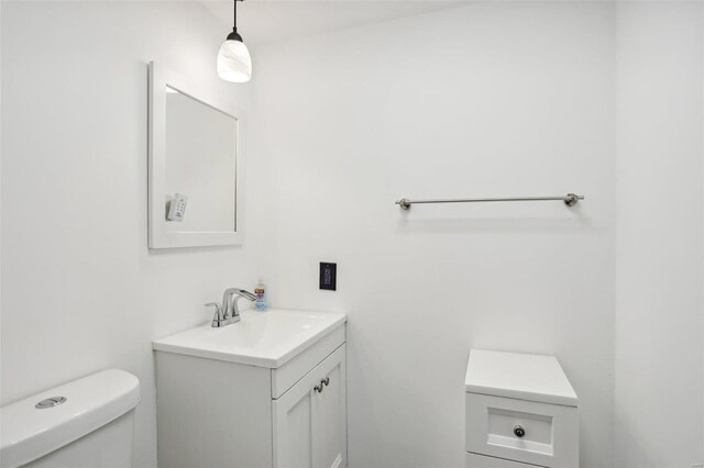 bathroom with toilet and vanity