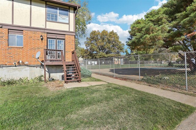 view of yard featuring stairs and fence