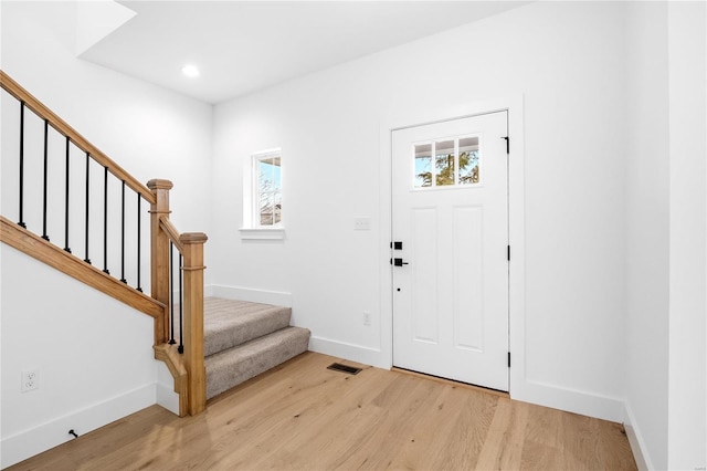 entryway featuring plenty of natural light and light hardwood / wood-style flooring