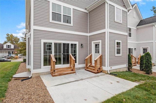 rear view of property featuring a patio area