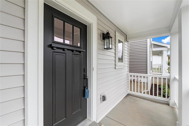 property entrance featuring a porch