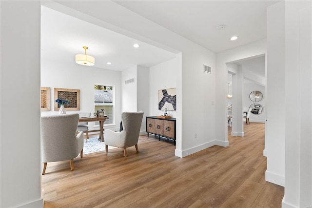 hall with hardwood / wood-style floors