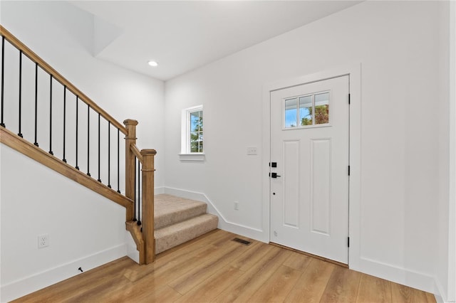 foyer entrance with light hardwood / wood-style flooring