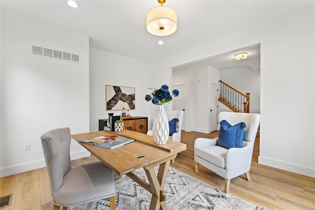 home office with hardwood / wood-style floors