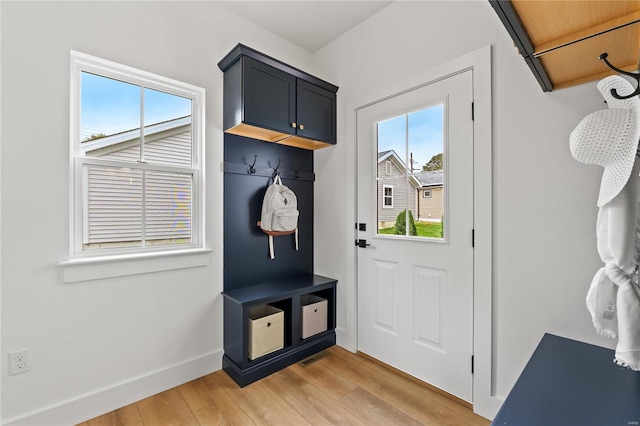 mudroom with light hardwood / wood-style floors