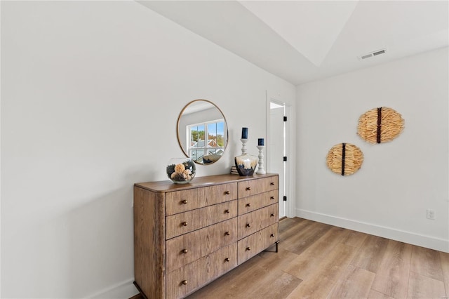 interior space featuring light hardwood / wood-style flooring and lofted ceiling