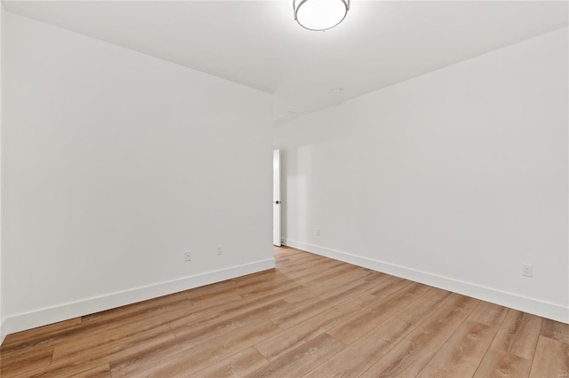 spare room with light hardwood / wood-style flooring