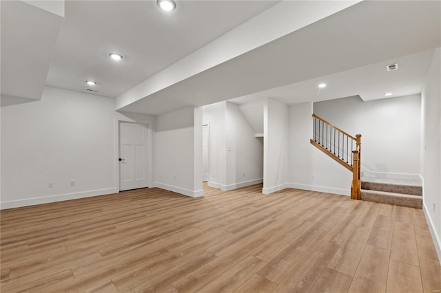 basement featuring light wood-type flooring