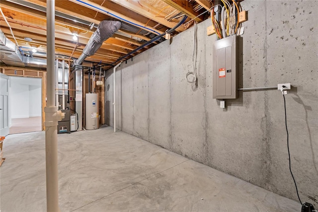 basement with electric panel and electric water heater