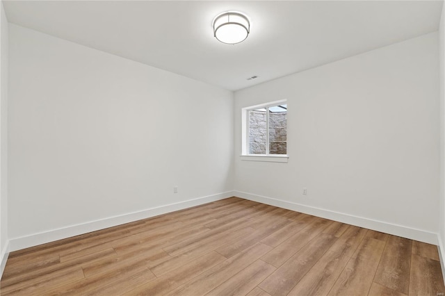 unfurnished room with light hardwood / wood-style flooring