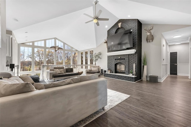 living room featuring ceiling fan, dark hardwood / wood-style flooring, a fireplace, and vaulted ceiling