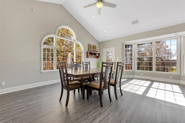 dining area featuring dark hardwood / wood-style flooring, high vaulted ceiling, and ceiling fan