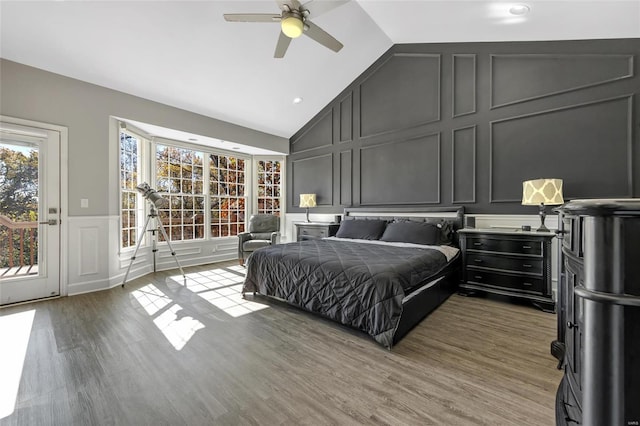 bedroom with access to exterior, ceiling fan, wood-type flooring, and vaulted ceiling