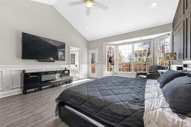 bedroom featuring hardwood / wood-style flooring, ceiling fan, and lofted ceiling