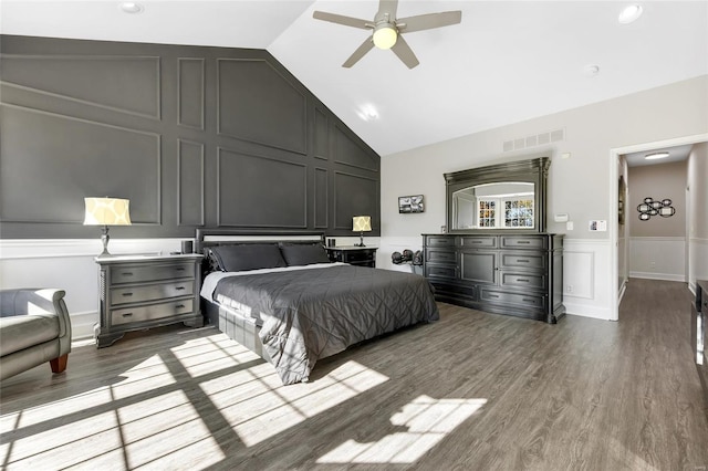 bedroom with ceiling fan, wood-type flooring, and lofted ceiling