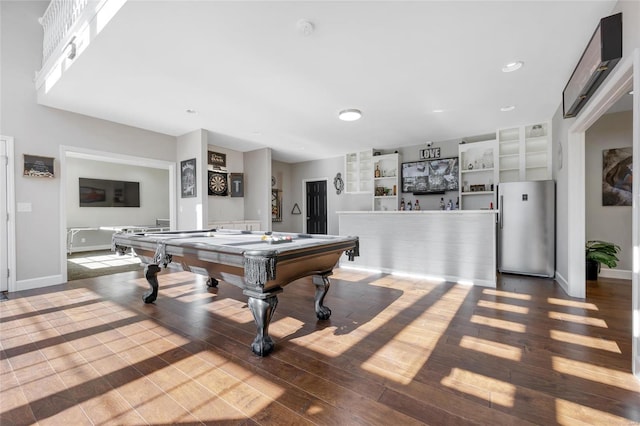 playroom with wood-type flooring, built in features, and pool table