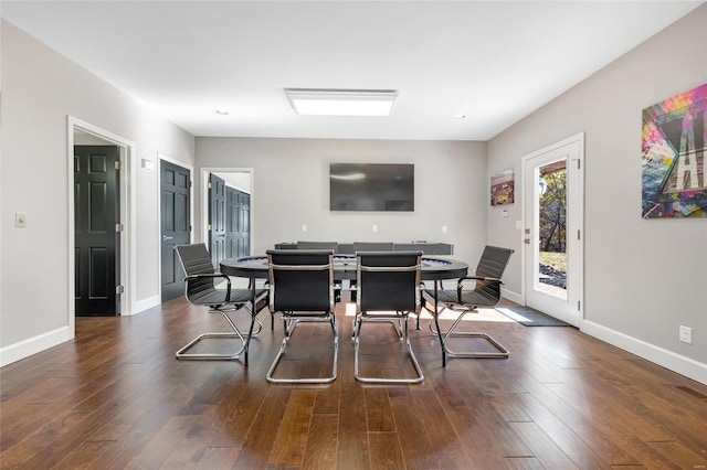 dining room with dark hardwood / wood-style flooring