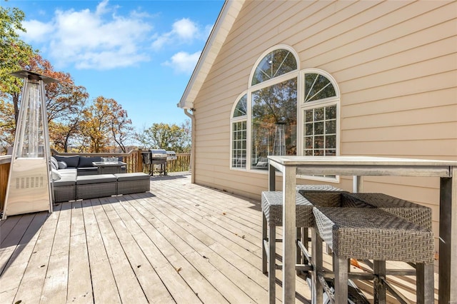 wooden deck featuring an outdoor living space