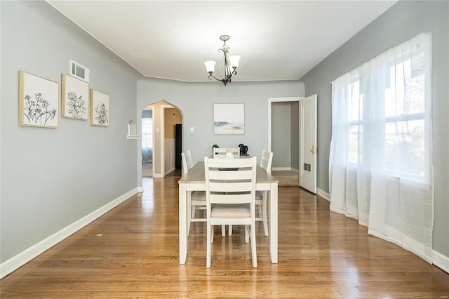 dining room featuring a chandelier and hardwood / wood-style flooring