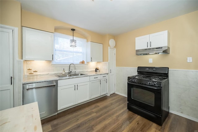 kitchen with black gas range, stainless steel dishwasher, decorative light fixtures, and white cabinets