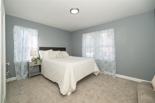 bedroom with light colored carpet