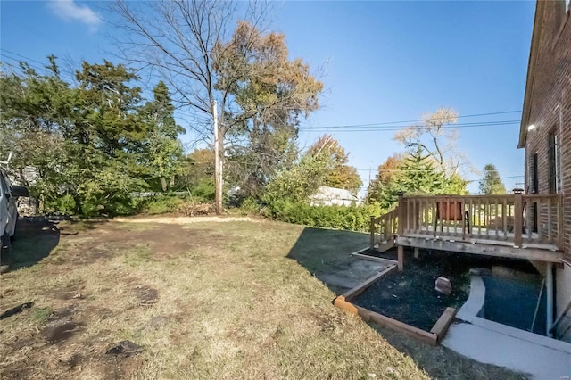 view of yard featuring a wooden deck