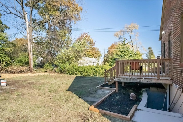 view of yard featuring a wooden deck