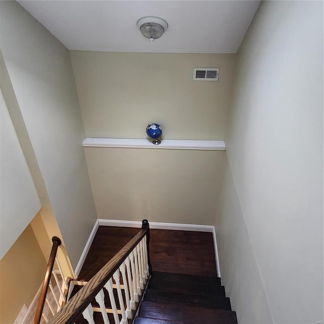 staircase featuring hardwood / wood-style flooring