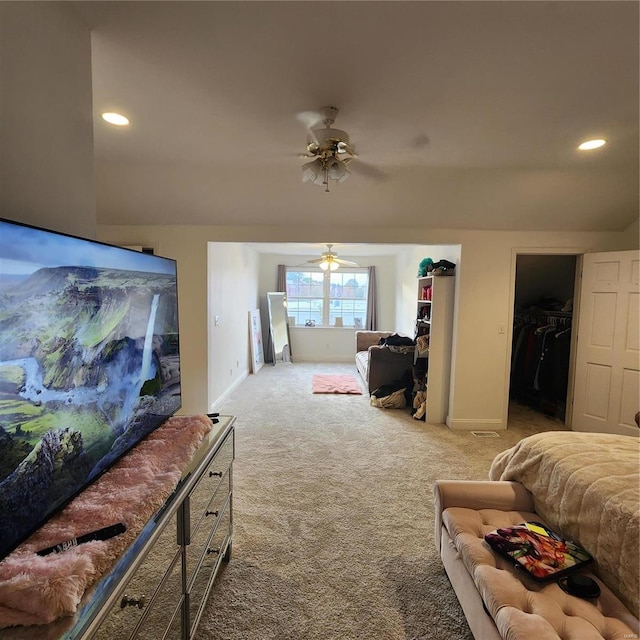 carpeted living room featuring ceiling fan