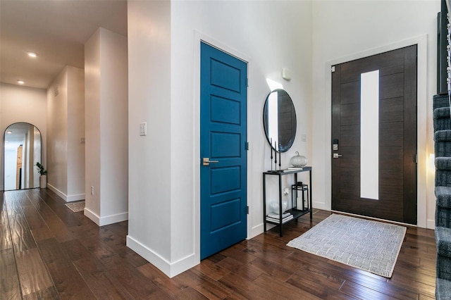 foyer with dark hardwood / wood-style floors