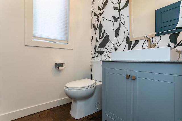 bathroom featuring hardwood / wood-style floors, vanity, and toilet