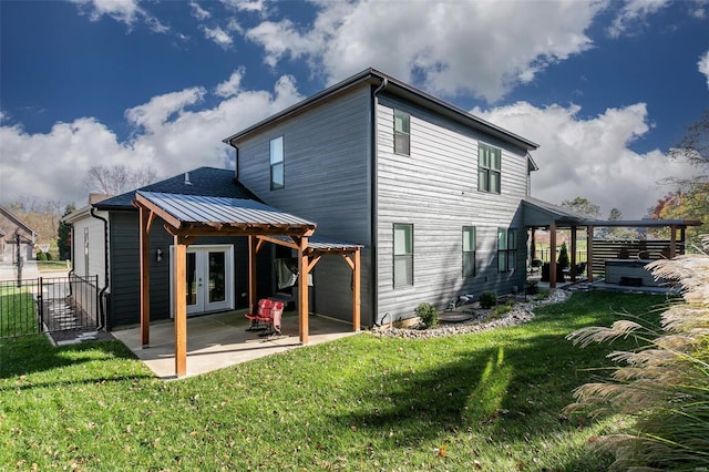 back of property featuring a yard and a patio area