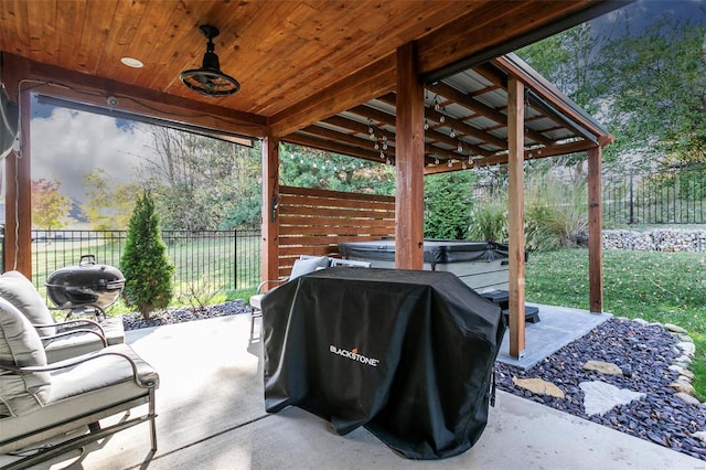 view of patio featuring a hot tub and grilling area