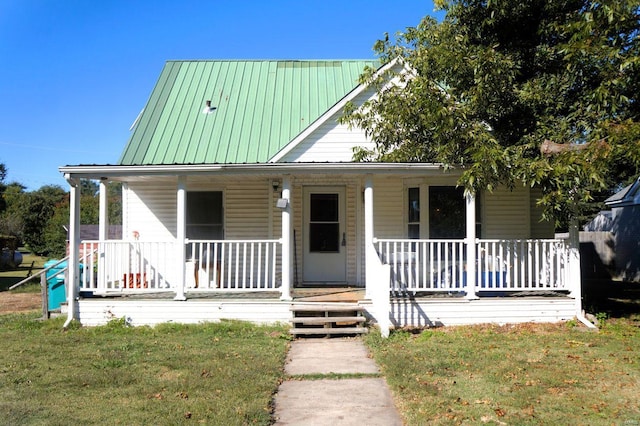 view of front of house with a porch and a front yard