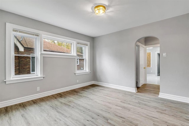 unfurnished room with light wood-type flooring