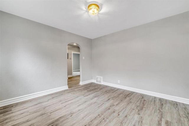 unfurnished room featuring light hardwood / wood-style floors