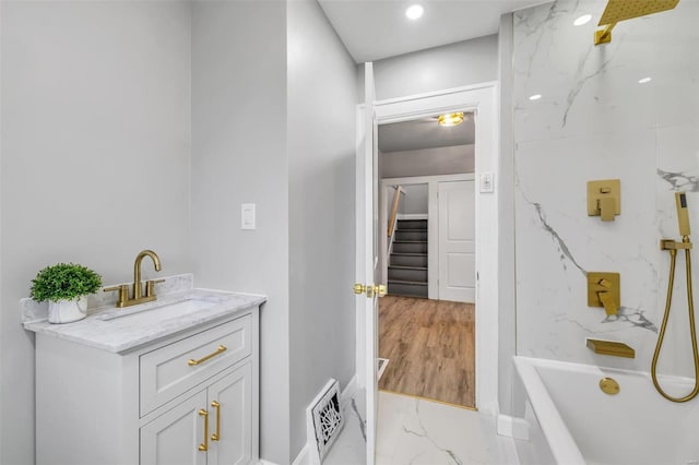 bathroom with hardwood / wood-style floors and vanity