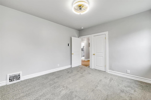 unfurnished bedroom with carpet