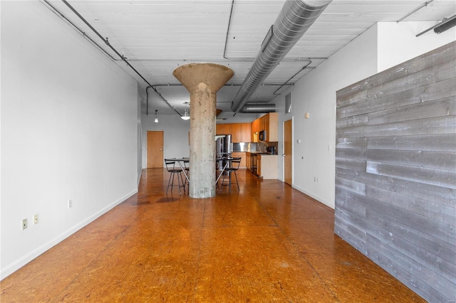 interior space featuring stainless steel fridge