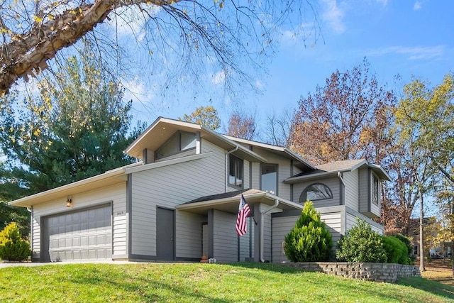 front of property featuring a garage and a front lawn