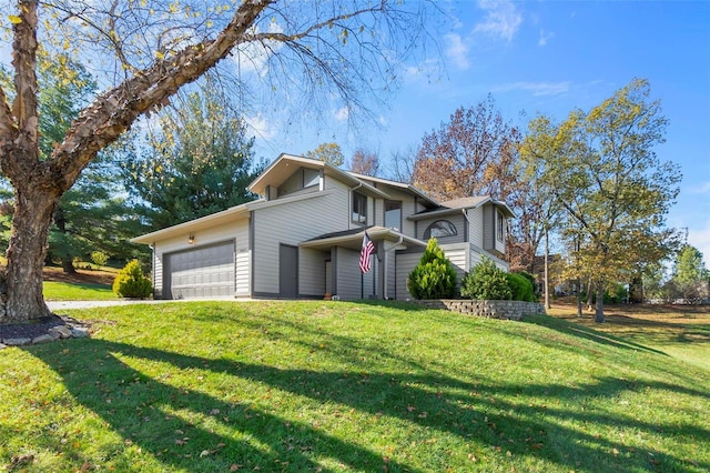 view of front of home featuring a garage and a front yard