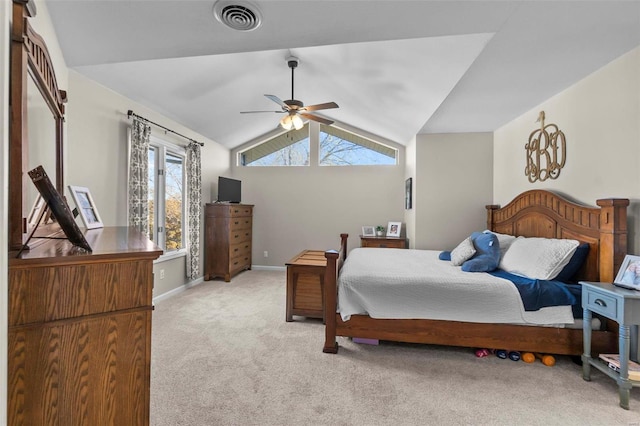 carpeted bedroom featuring ceiling fan and vaulted ceiling