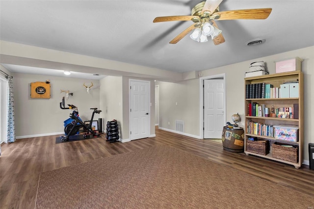 interior space featuring ceiling fan and dark hardwood / wood-style floors