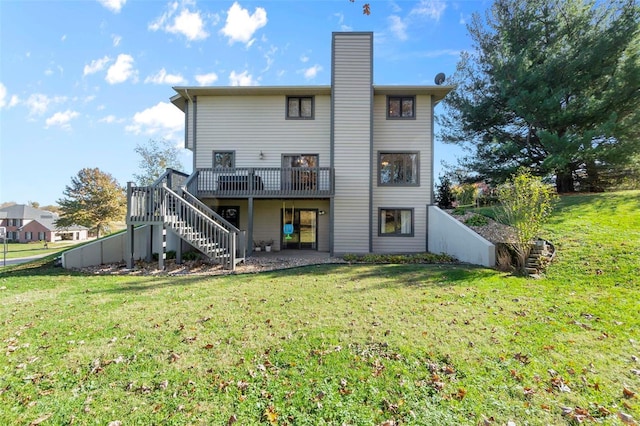 rear view of property with a lawn and a deck