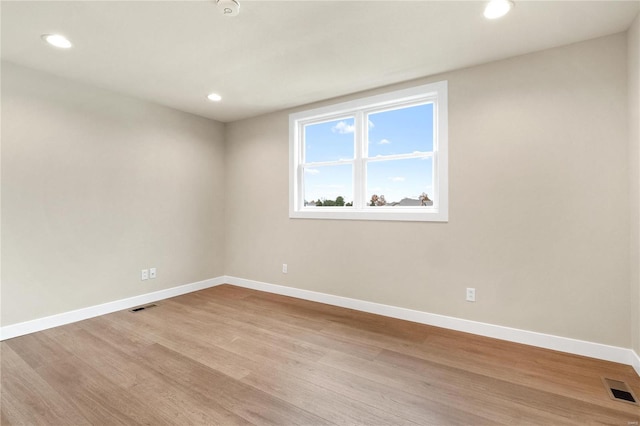 empty room with light wood-type flooring