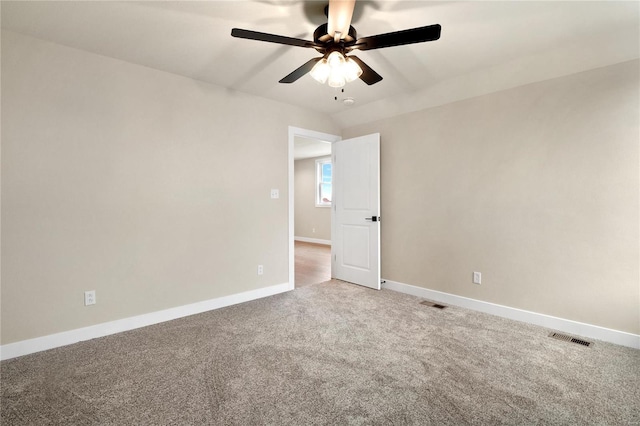 spare room featuring carpet floors and ceiling fan